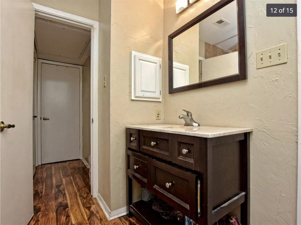 806 West 24th Street, Unit 331 Austin, TX 78705 - Photo 11 of 12 a bathroom with a sink vanity and mirror