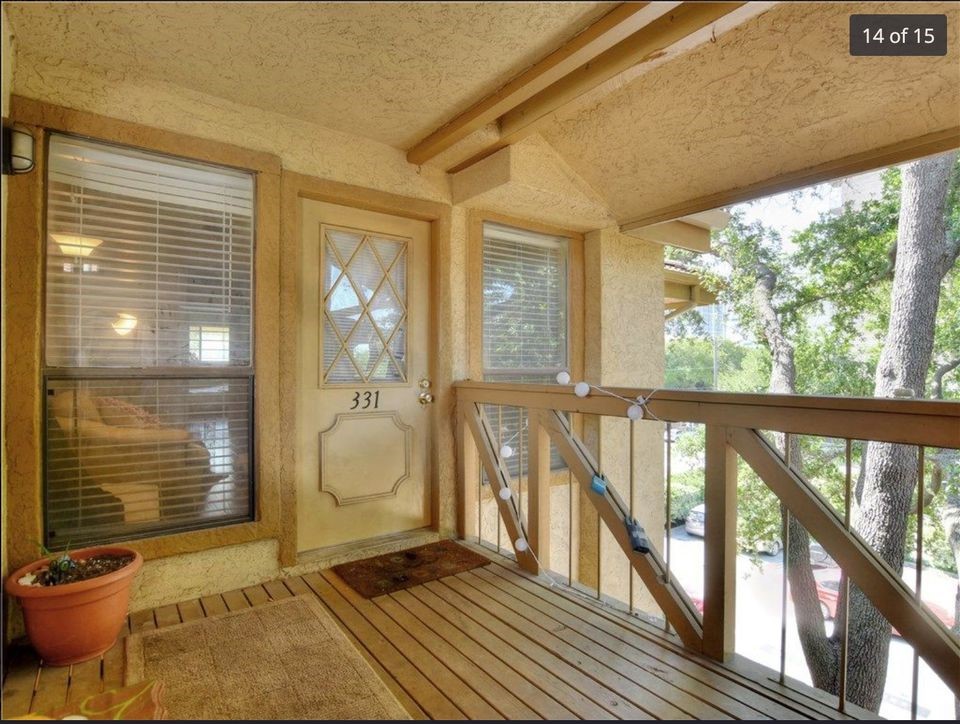 806 West 24th Street, Unit 331 Austin, TX 78705 - Photo 2 of 12 a view of an entryway with wooden floor and door