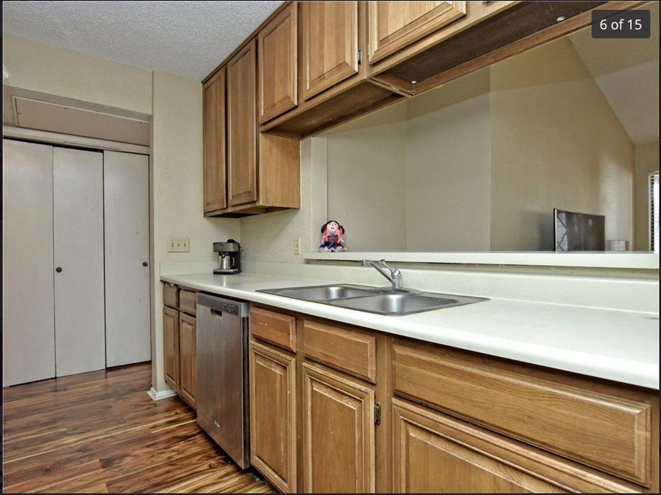 806 West 24th Street, Unit 331 Austin, TX 78705 - Photo 4 of 12 a kitchen with stainless steel appliances granite countertop a sink and cabinets