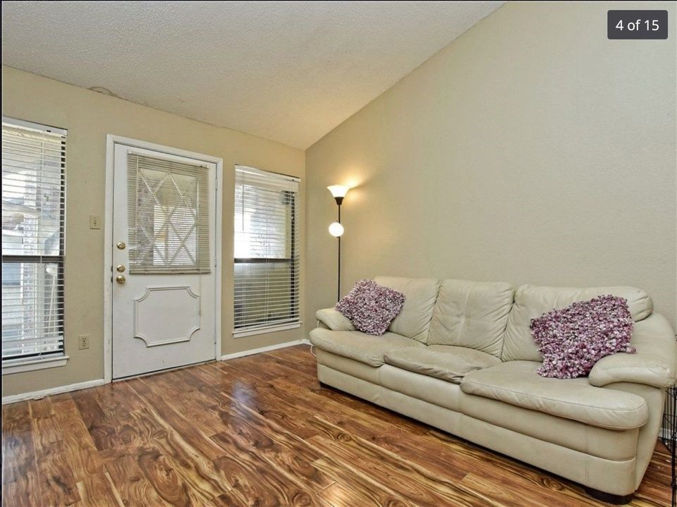 806 West 24th Street, Unit 331 Austin, TX 78705 - Photo 7 of 12 a living room with furniture and a window