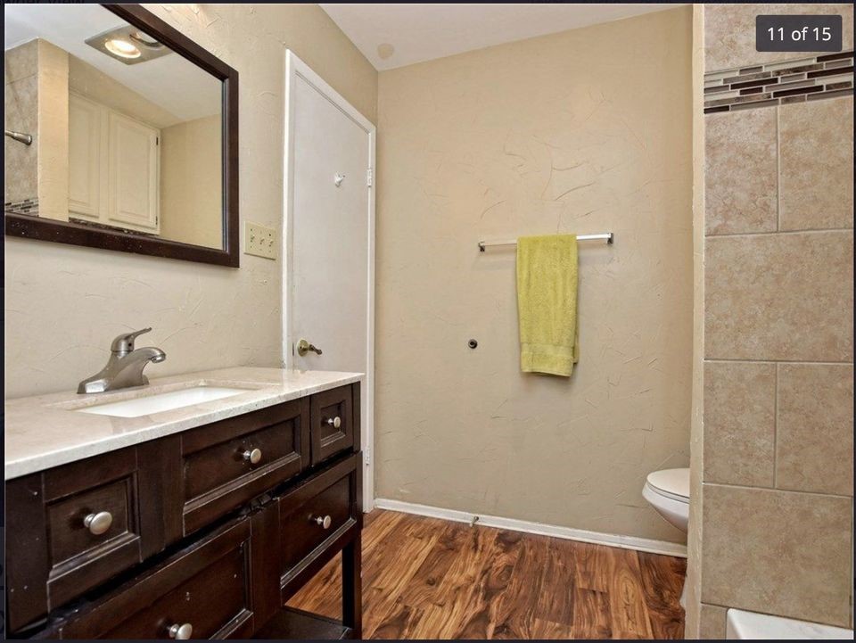 806 West 24th Street, Unit 331 Austin, TX 78705 - Photo 8 of 12 a bathroom with a sink and a mirror