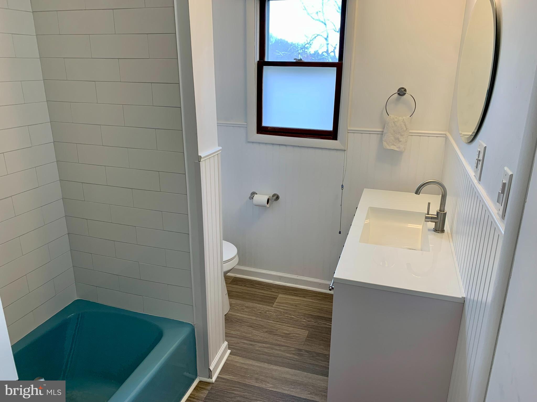 1207 Scott Street Reading, PA 19611 - Photo 17 of 25 a bathroom with a sink and a shower