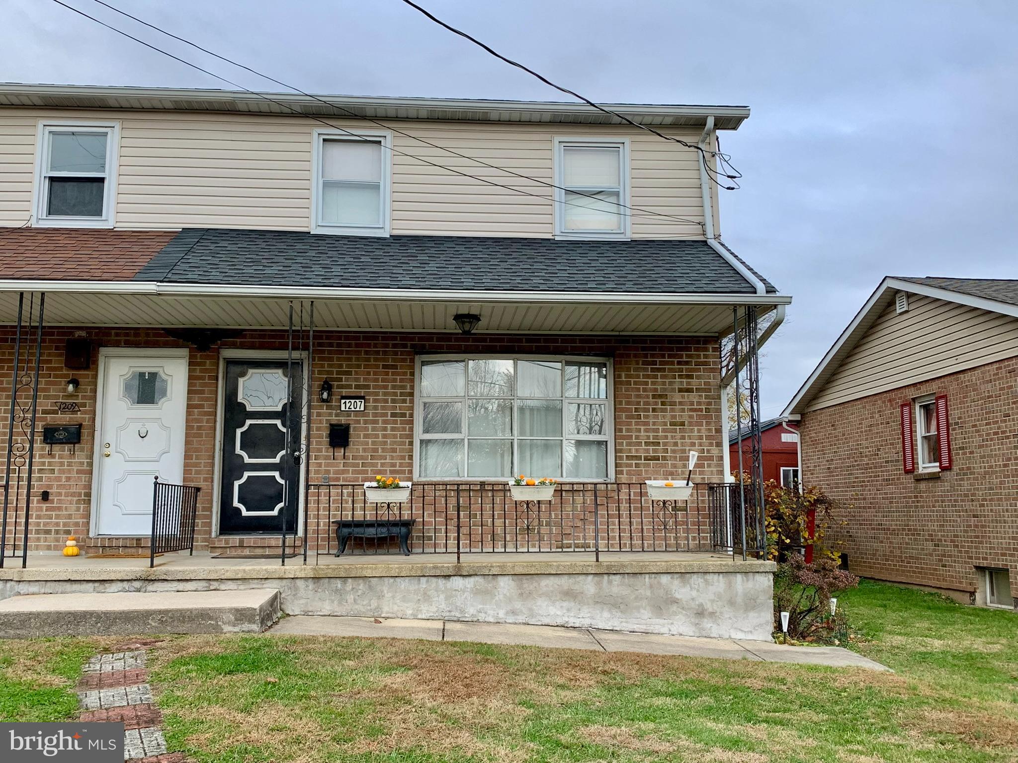1207 Scott Street Reading, PA 19611 - Photo 2 of 25 a front view of a house