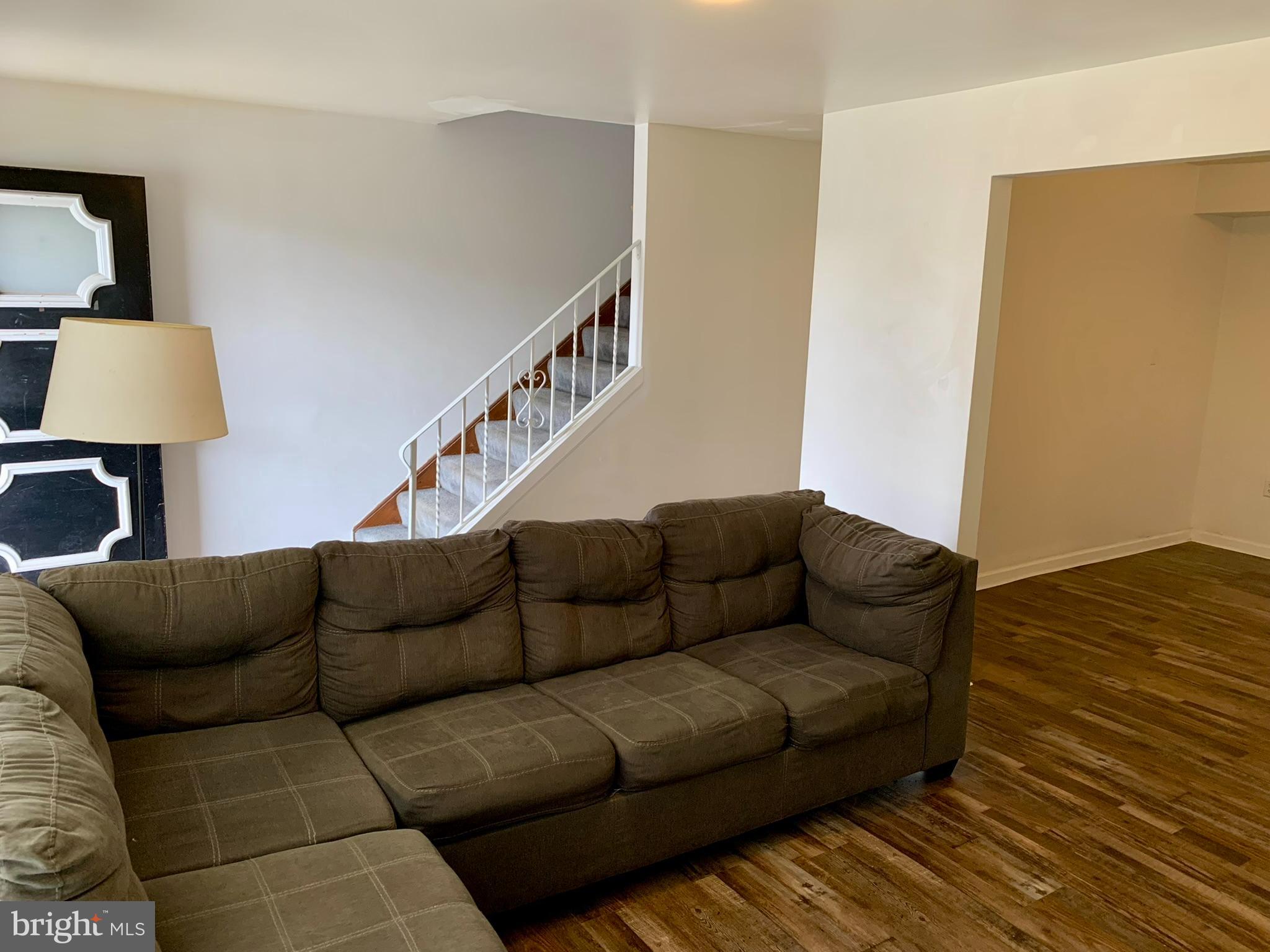 1207 Scott Street Reading, PA 19611 - Photo 3 of 25 a living room with furniture and a wooden floor