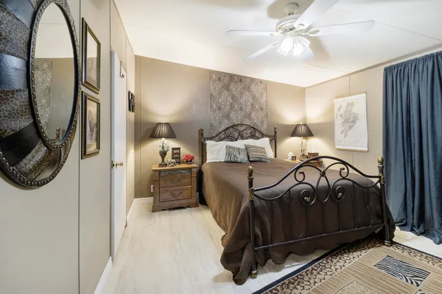 a view of a room with furniture and wooden floor