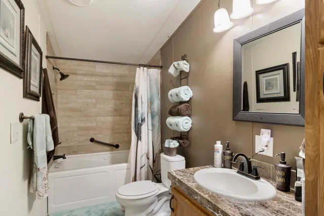 a kitchen with a stove a refrigerator and a sink