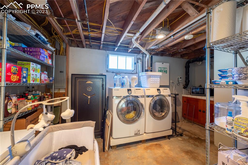 24141 Eccles Street Elbert, CO 80106 - Photo 15 of 37 a utility room with dryer washer and stair