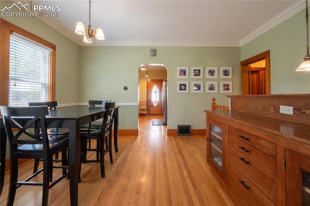 24141 Eccles Street Elbert, CO 80106 - Photo 20 of 37 a view of a dining room with furniture and wooden floor