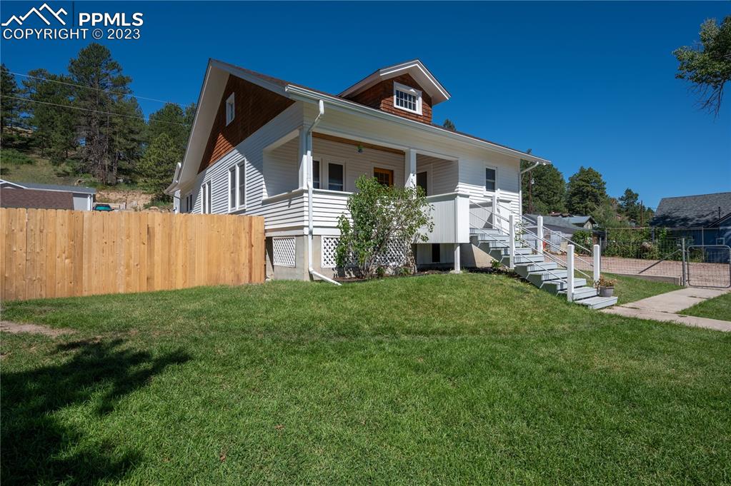 24141 Eccles Street Elbert, CO 80106 - Photo 2 of 37 a view of a house with backyard and garden