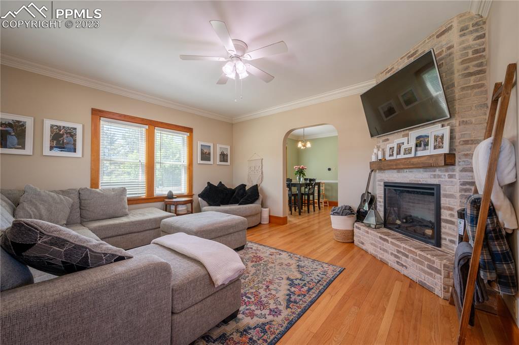 24141 Eccles Street Elbert, CO 80106 - Photo 28 of 37 a living room with furniture a fireplace and a flat screen tv