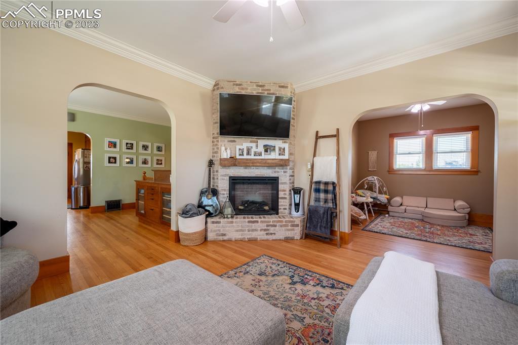 24141 Eccles Street Elbert, CO 80106 - Photo 29 of 37 a living room with furniture a flat screen tv and a fireplace