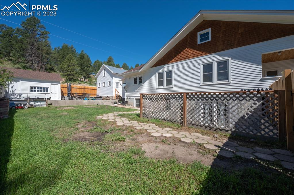 24141 Eccles Street Elbert, CO 80106 - Photo 3 of 37 a front view of a house with a yard