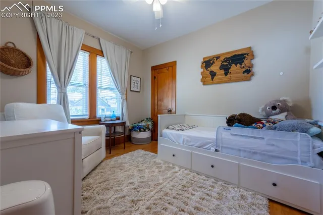 a spacious bedroom with a bed and a couch