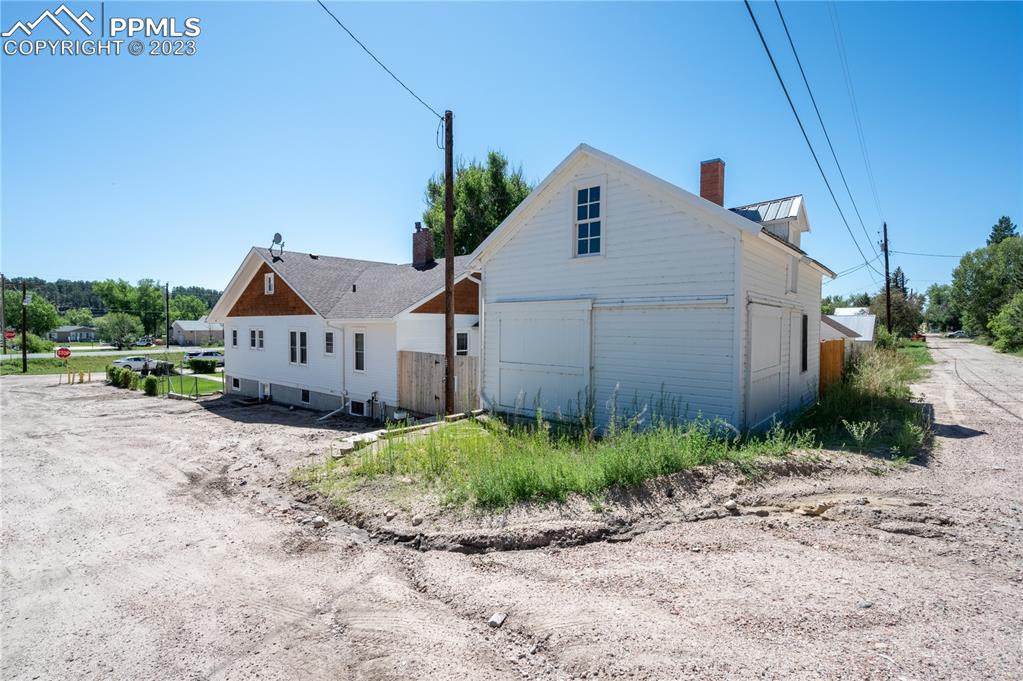 24141 Eccles Street Elbert, CO 80106 - Photo 7 of 37 a view of a house with a small yard and wooden fence