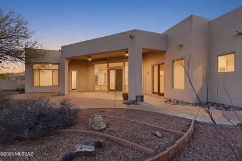a view of a house with backyard and porch