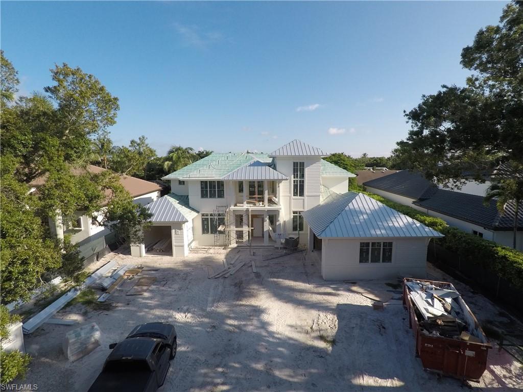 725 Riviera Drive Naples, FL 34103 - Photo 5 of 5 a front view of a house with garden