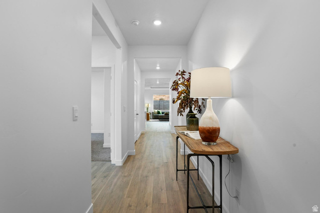 1624 South Staircase Way, Unit 4183 Washington, UT 84780 - Photo 30 of 47 Hardwood-finish flooring extending through a brightly lit hallway