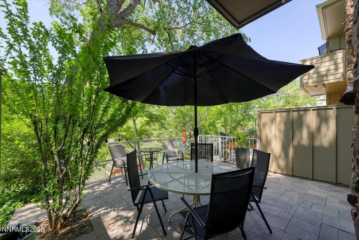 1308 Jones Street Reno, NV 89503 - Photo 35 of 47 a view of an outdoor dining space with a table and chairs under an umbrella