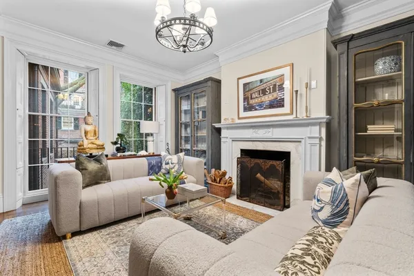 a living room with furniture and a fireplace