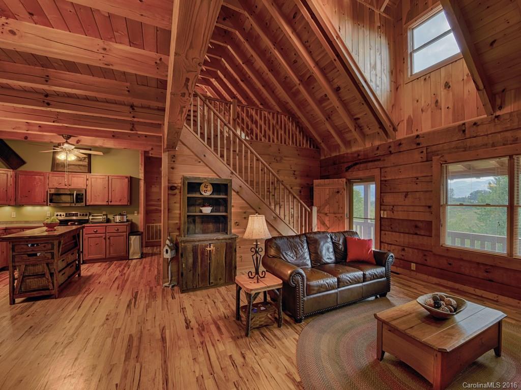 334 Ridgeview Lane Canton, NC 28716 - Photo 12 of 24 a living room with furniture and a wooden floor