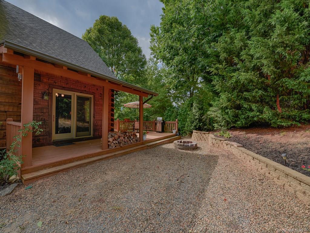 334 Ridgeview Lane Canton, NC 28716 - Photo 7 of 24 a view of a patio with table and chairs and potted plants