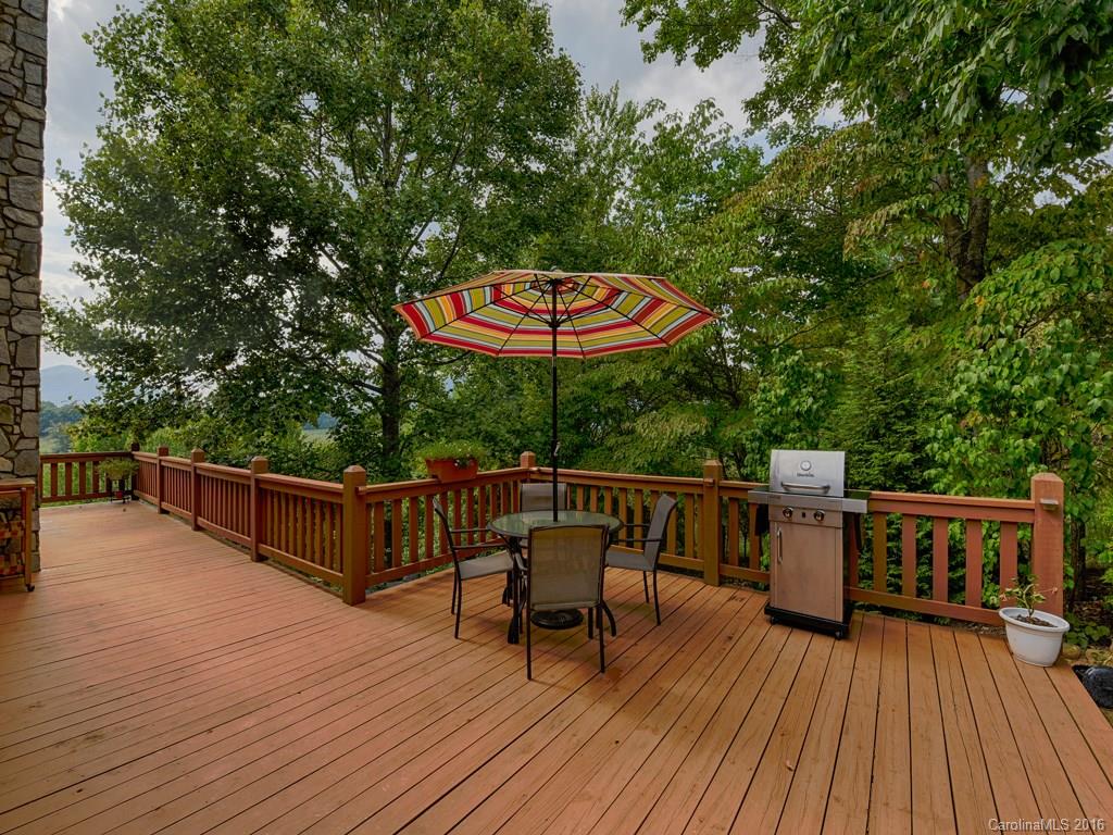 334 Ridgeview Lane Canton, NC 28716 - Photo 9 of 24 a balcony with wooden floor table and chairs