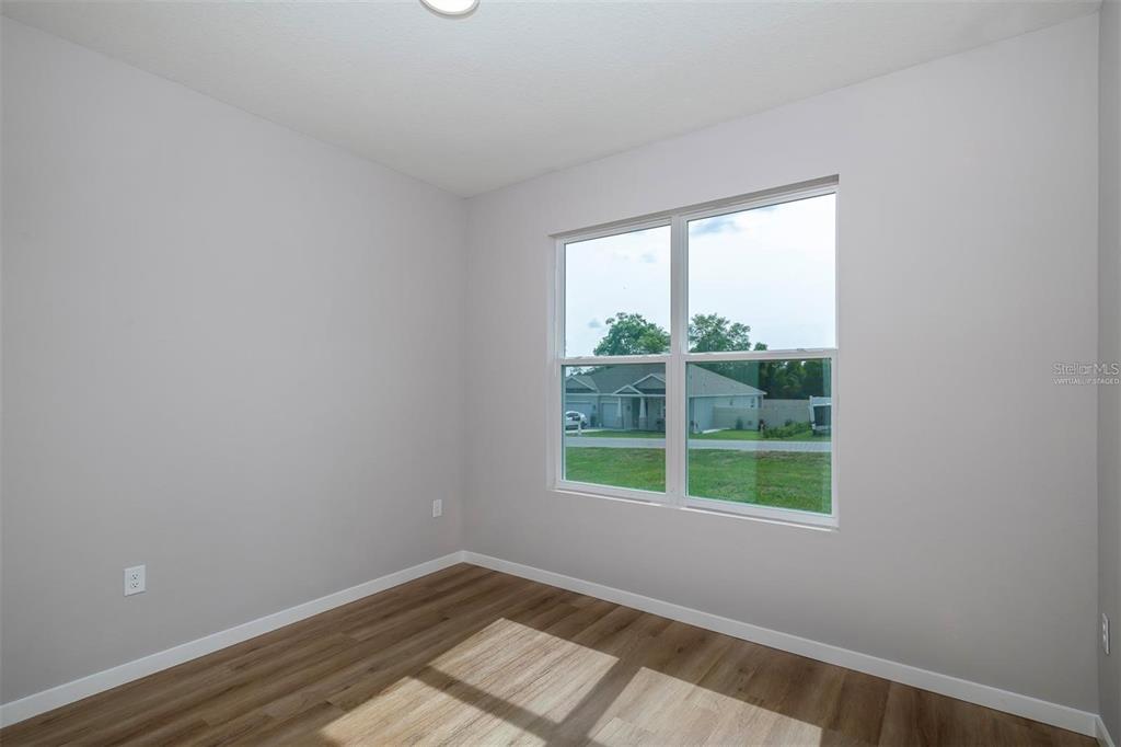 4347 Southwest 112th Lane Ocala, FL 34476 - Photo 11 of 21 an empty room with a window