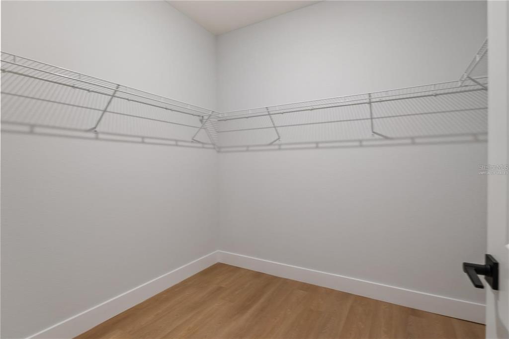 4347 Southwest 112th Lane Ocala, FL 34476 - Photo 15 of 21 a view of a room with racks on the wall