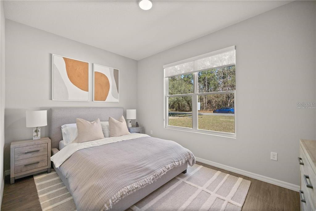 4347 Southwest 112th Lane Ocala, FL 34476 - Photo 19 of 21 a bedroom with a bed and a window