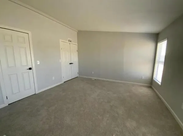 a view of an empty room and window