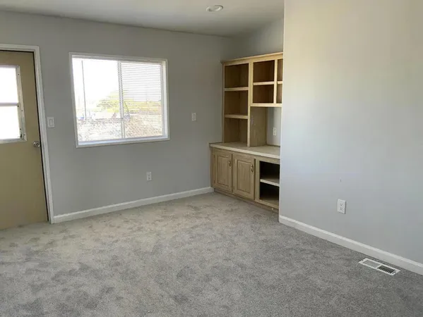 an empty room with windows