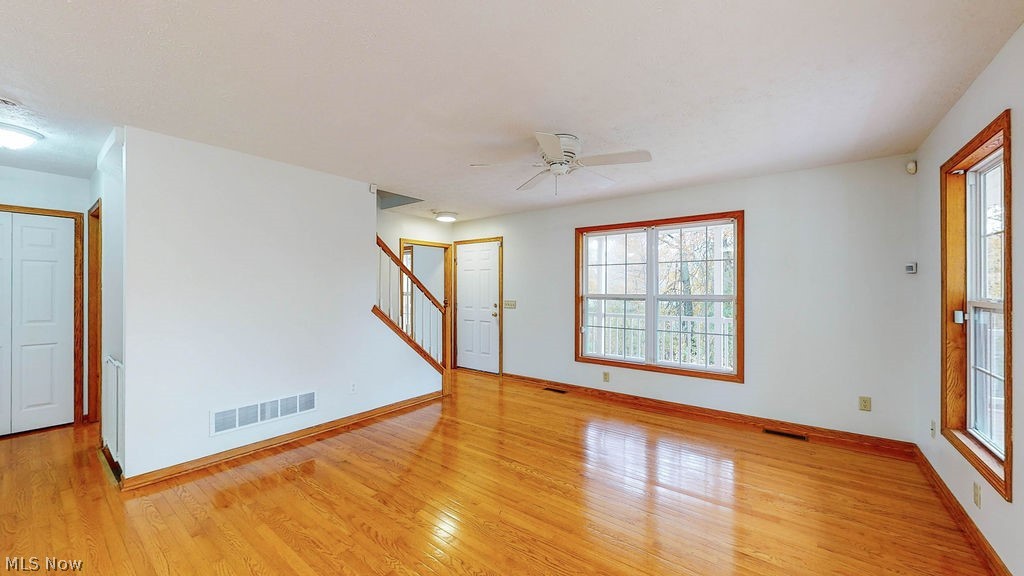 763 Pontius Road Mogadore, OH 44260 - Photo 5 of 20 LIVING ROOM WITH DOUBLE WINDOWS AND HARDWOOD FLOORS.