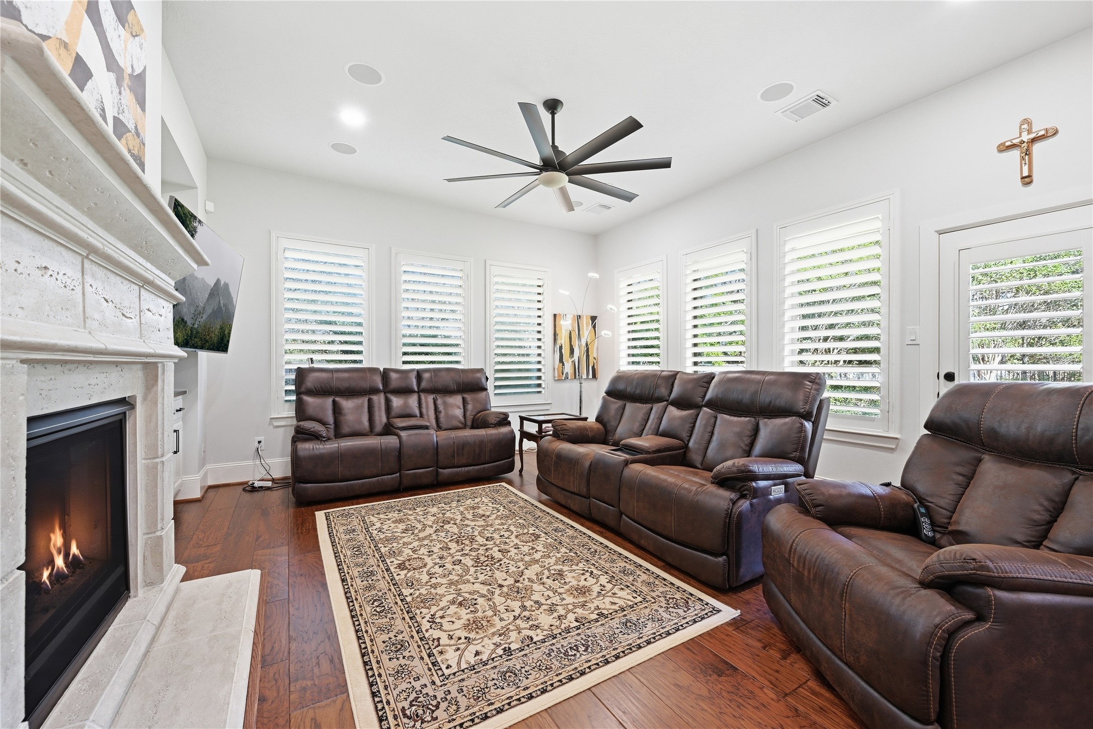 7 Sleeping Colt Place Spring, TX 77389 - Photo 15 of 32 Open living area with gas-log fireplace and plantation shutters