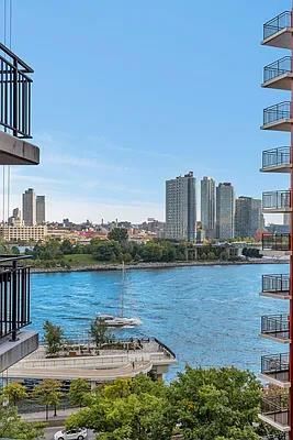 60 Sutton Place South, Unit 11FN Manhattan, NY 10022 - Photo 2 of 10 a view of a city with an ocean