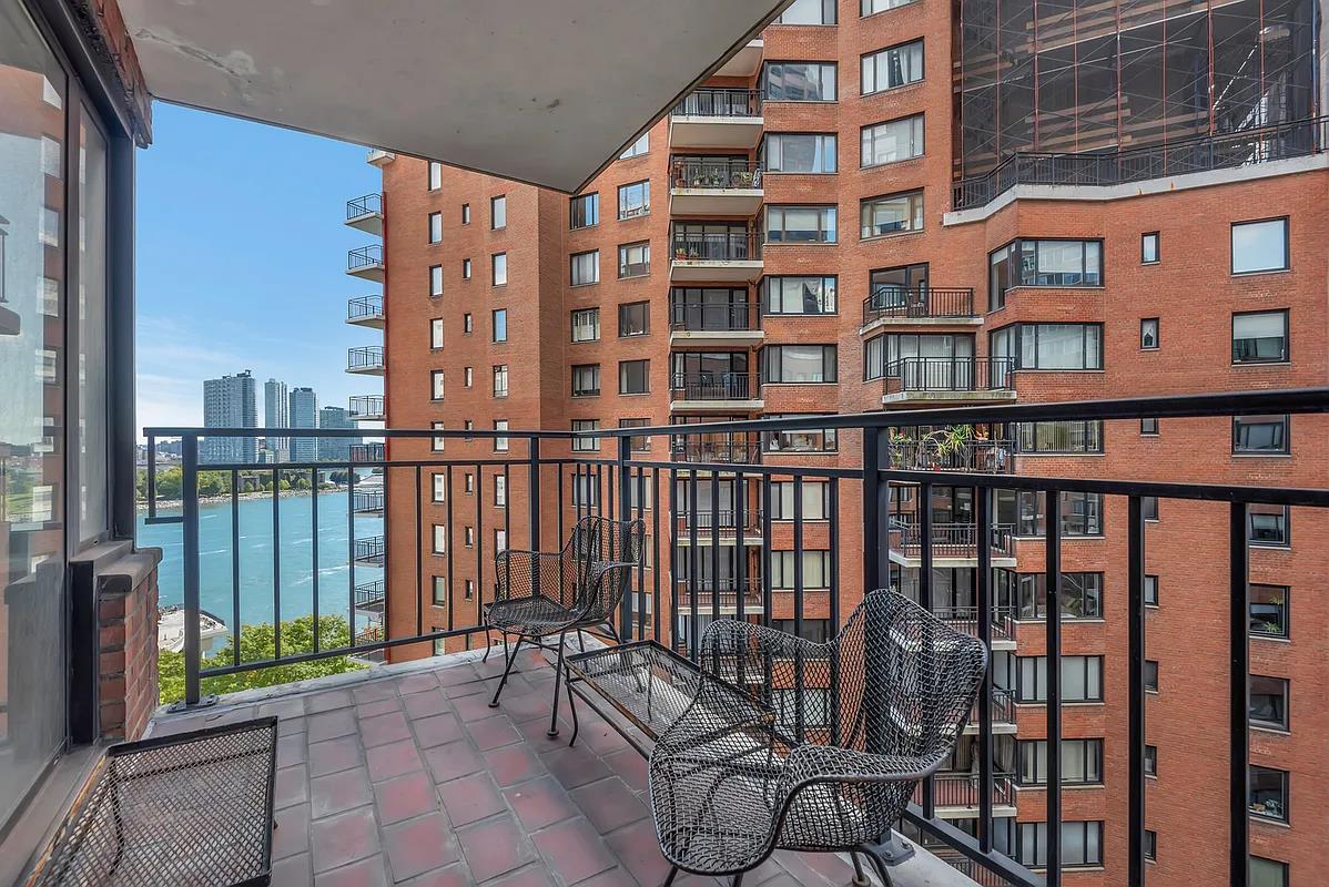 60 Sutton Place South, Unit 11FN Manhattan, NY 10022 - Photo 4 of 10 a view of a building from a balcony