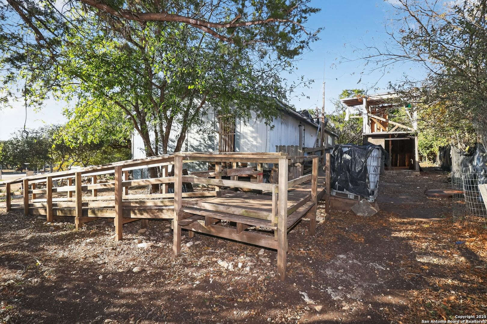 833 High Drive Spring Branch, TX 78070 - Photo 26 of 30 a view of a chairs setting on the backyard