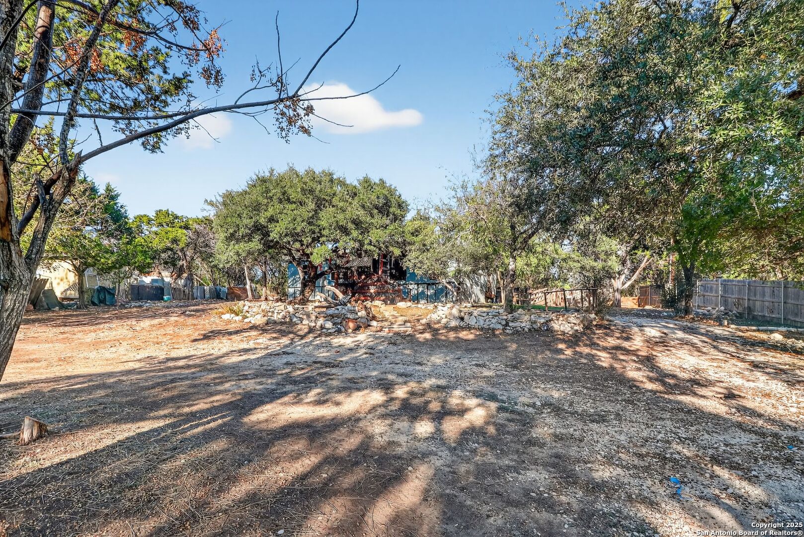 833 High Drive Spring Branch, TX 78070 - Photo 7 of 30 a view of a yard with a tree