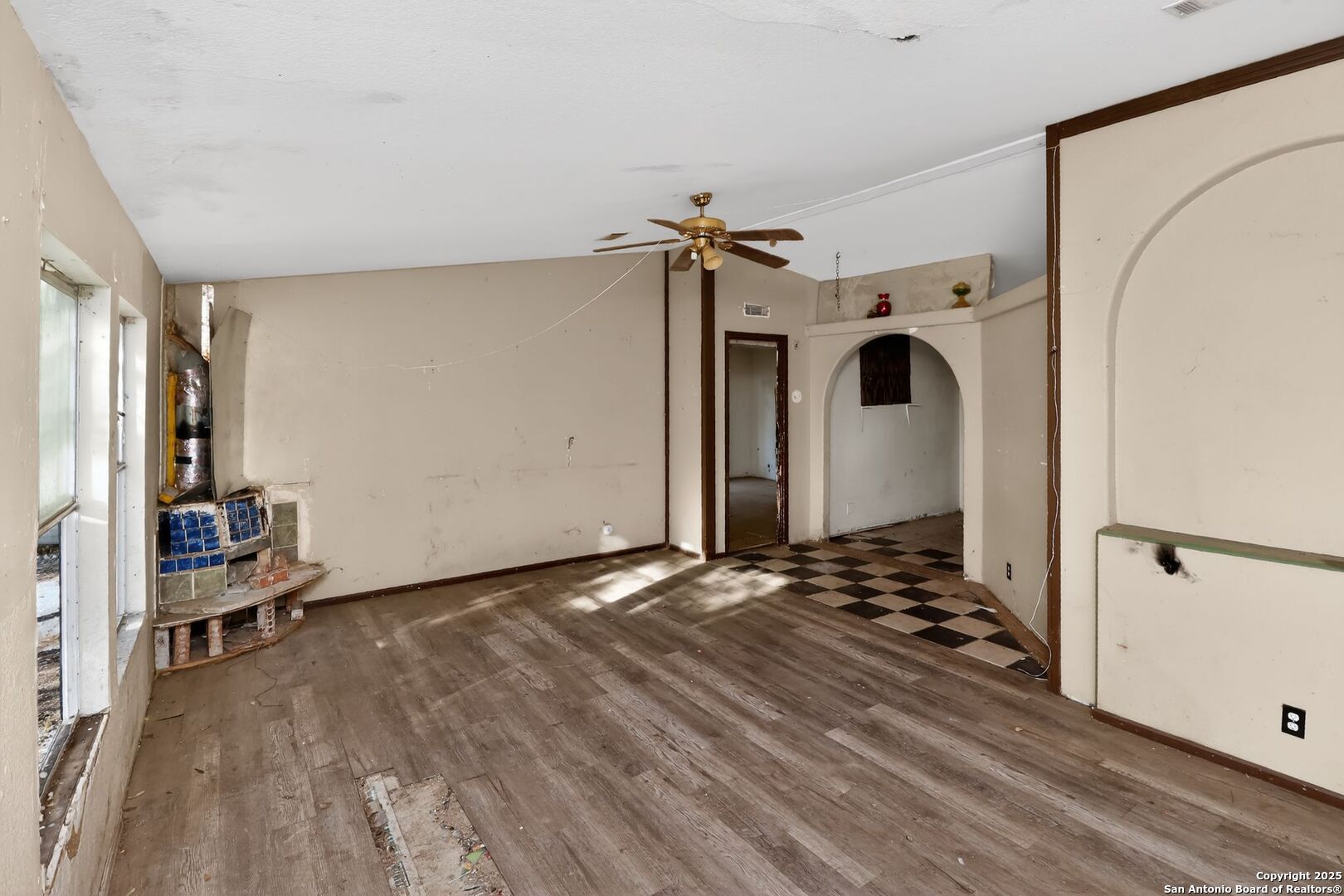 833 High Drive Spring Branch, TX 78070 - Photo 10 of 30 a view of a livingroom with wooden floor and a ceiling fan