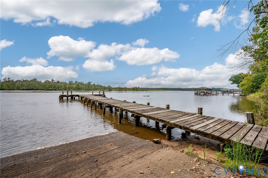 123 Riverview Road Stevensville, VA 23161 - Photo 24 of 28 Wood-plank dock extending over open water with a c