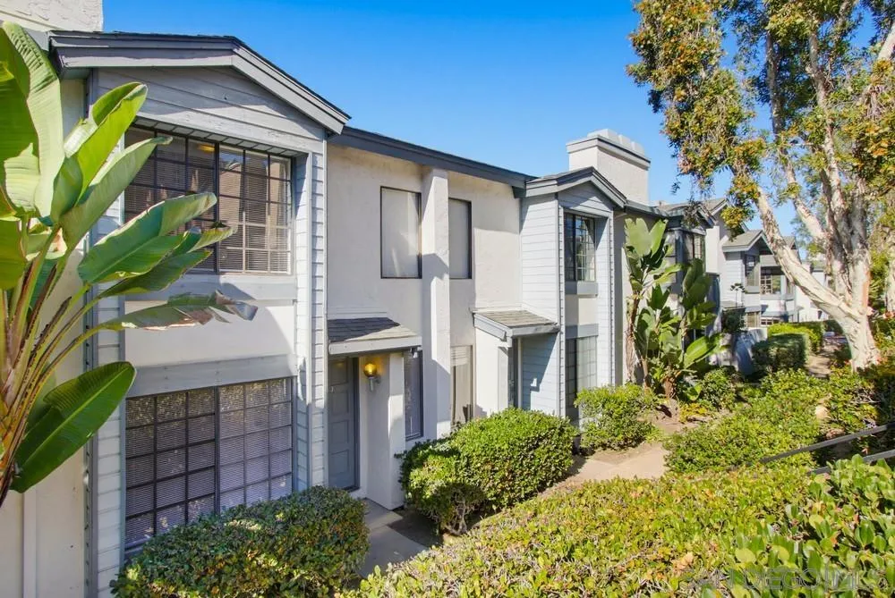 8868 Regents Road, Unit 103 San Diego, CA 92122 - Photo 3 of 50 a front view of a house with a yard