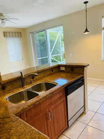 a kitchen that has a sink and a stove