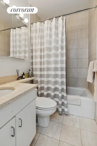 a kitchen that has a sink and a stove in it