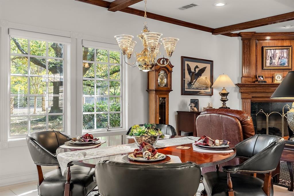 1 Willow Ridge Road Greenville, TX 75402 - Photo 13 of 38 a dining room with furniture a large window and a chandelier