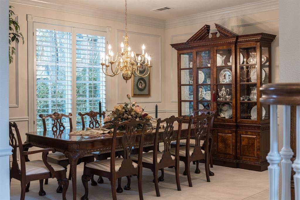 1 Willow Ridge Road Greenville, TX 75402 - Photo 15 of 38 a view of a dining room with furniture and chandelier