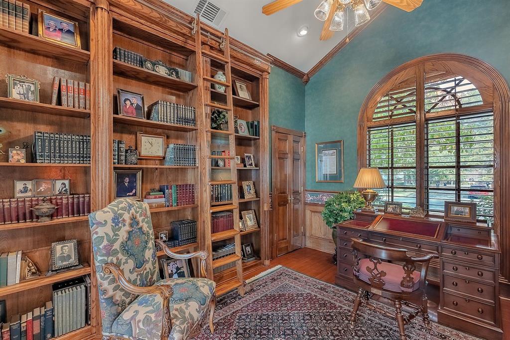 1 Willow Ridge Road Greenville, TX 75402 - Photo 18 of 38 a room with bookshelf and a large window