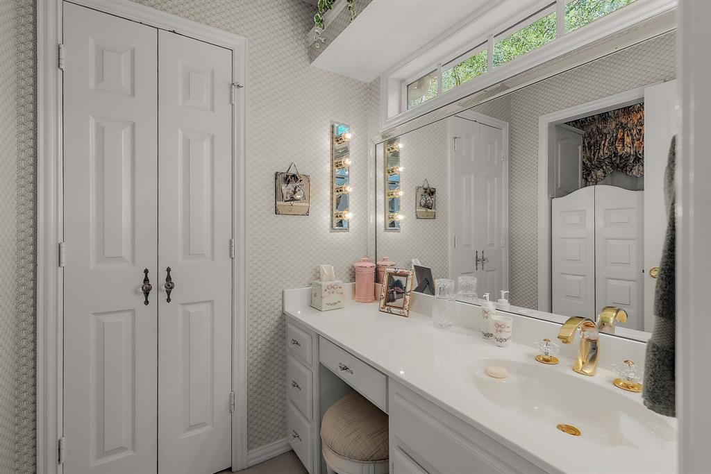 1 Willow Ridge Road Greenville, TX 75402 - Photo 22 of 38 a bathroom with a sink and a mirror