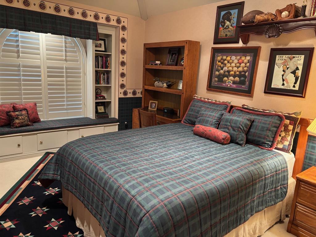 1 Willow Ridge Road Greenville, TX 75402 - Photo 24 of 38 a bedroom with a bed and dresser