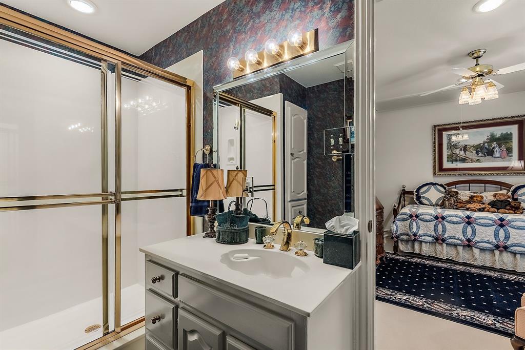 1 Willow Ridge Road Greenville, TX 75402 - Photo 27 of 38 a bathroom with a sink and a mirror