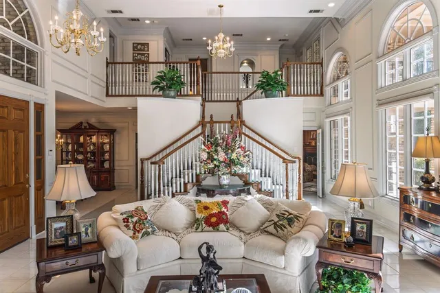 a bedroom with a bed couch and window