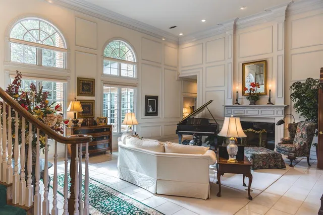 a bedroom with a bed couch and window